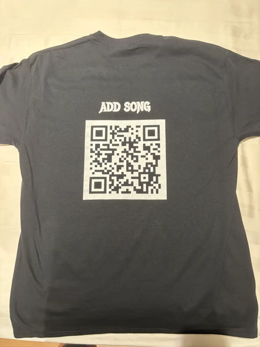 Back of the Night Mission shirt with a QR code linking to the song