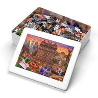 Open metal tin for the 2,000-piece Bellevue Hotel Philadelphia jigsaw puzzle, with pieces inside and artwork on the lid